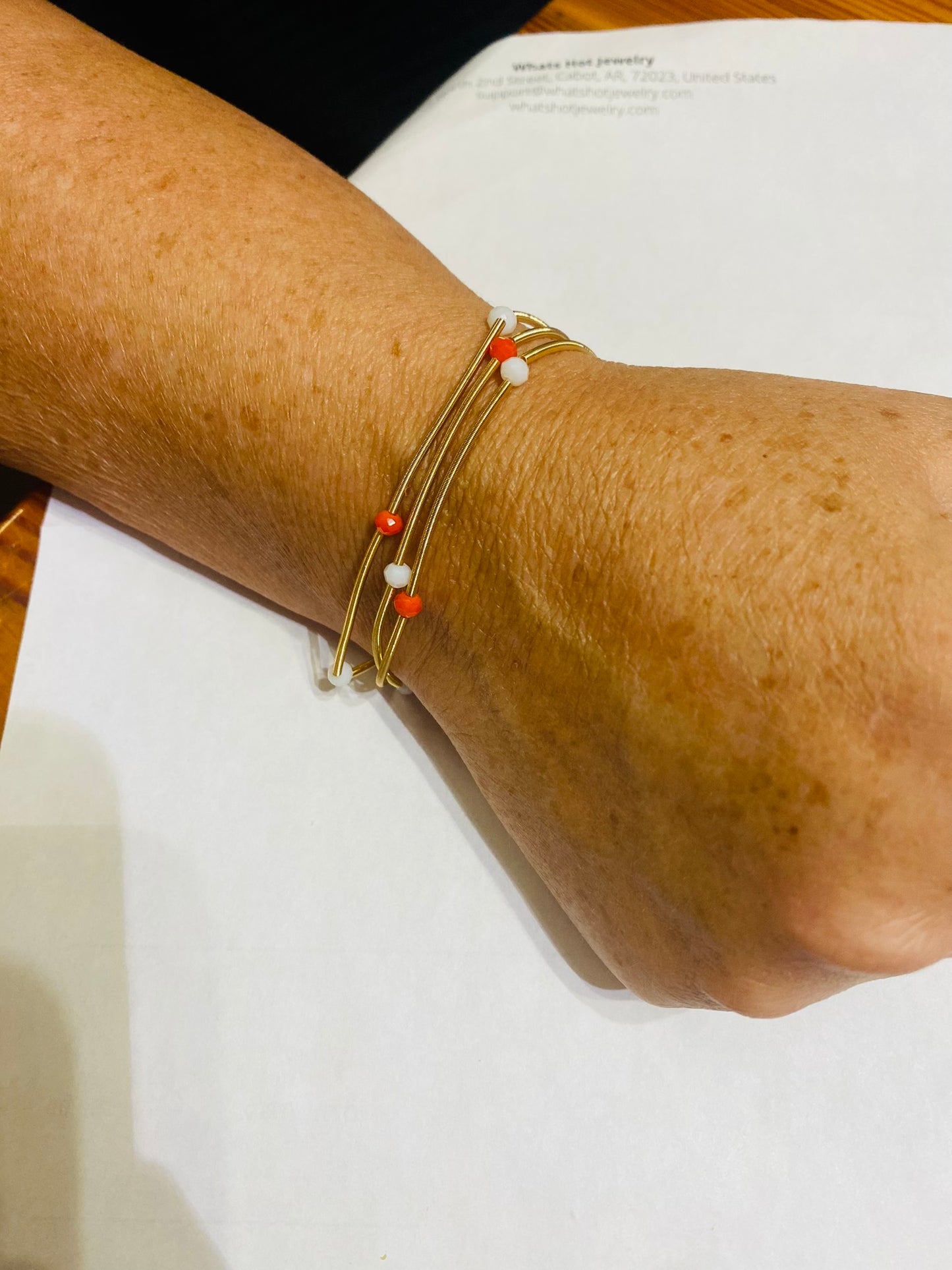 Orange and white wire bracelets